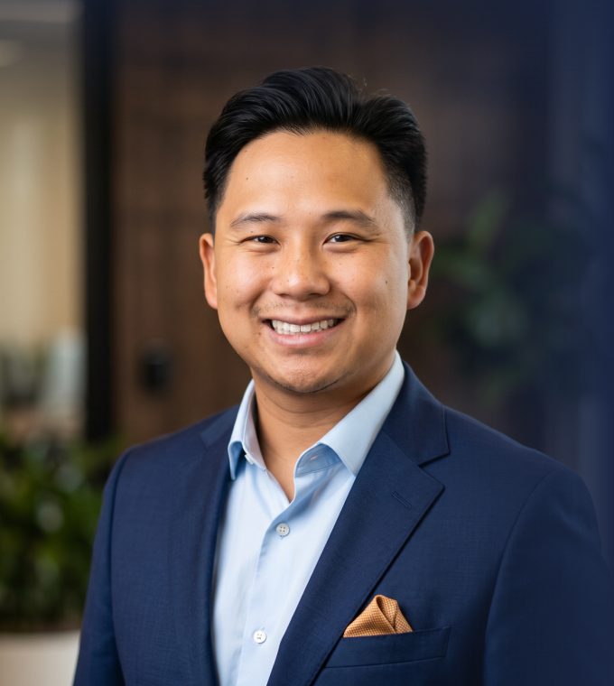 Portrait of Tshwjxeeb Vaaj in a navy blazer